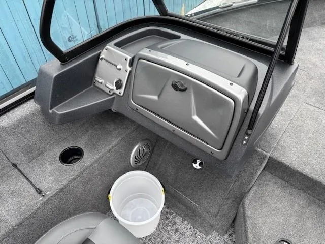 Slide: The Image of 2025 Tracker Pro Guide V-175 WT boat interior with storage compartment and bucket. - 18