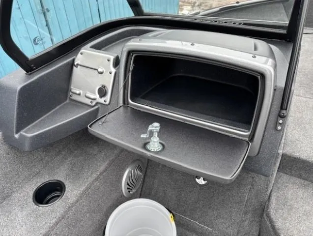Slide: The Image of 2025 Tracker Pro Guide V-175 WT boat interior with open storage compartment. - 19