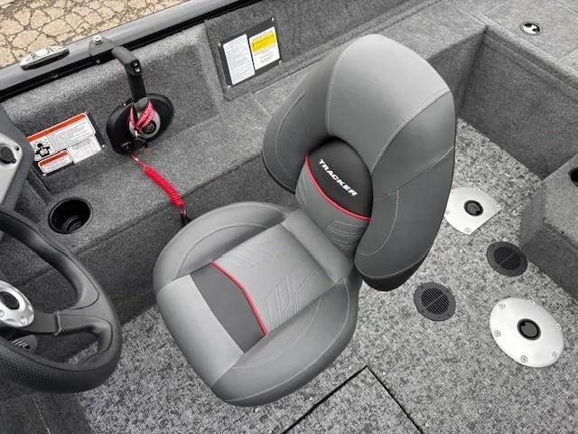 Slide: The Image of 2025 Tracker Pro Guide V-175 WT boat interior with gray seating and steering wheel. - 20