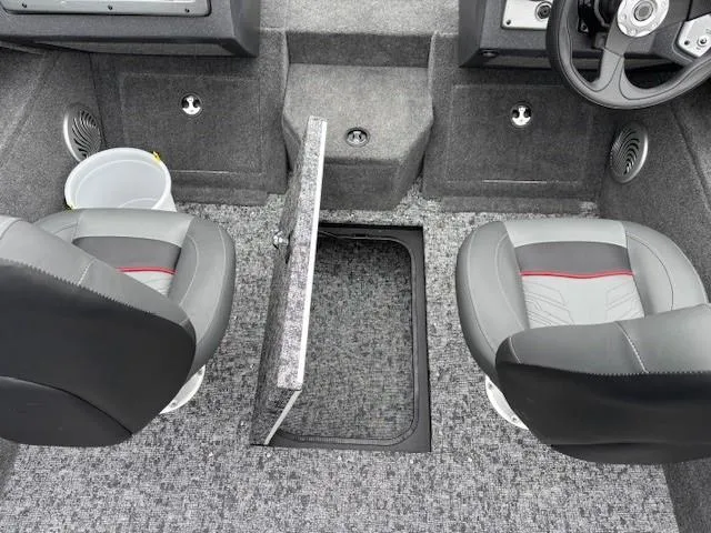 Slide: The Image of 2025 Tracker Pro Guide V-175 WT boat interior with two seats and storage compartment. - 23