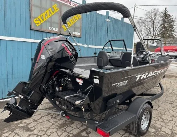 Slide: The Image of 2025 Tracker Pro Guide V-175 WT boat with outboard motor, parked on a trailer. - 3