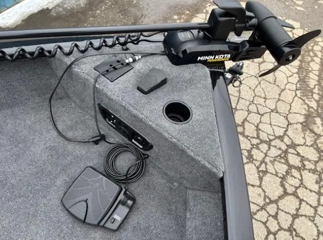 Slide: The Image of 2025 Tracker Pro Guide V-175 WT boat with Minn Kota trolling motor and foot pedal controls. - 8