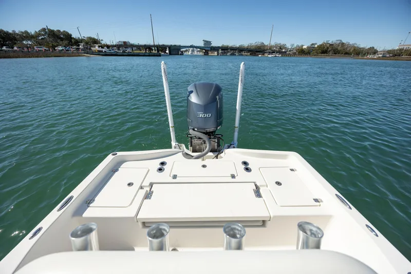 Slide: The Image of 2017 Avenger AV24 boat on water, featuring a powerful outboard motor. - 10