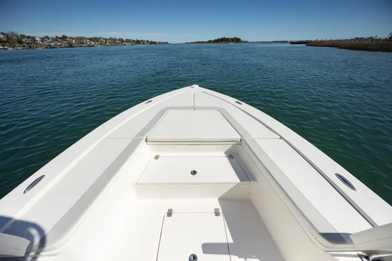 Slide: The Image of Bow view of 2017 Avenger AV24 boat on calm water. - 17