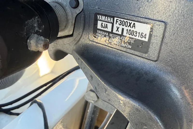 Slide: The Image of Close-up of Yamaha F300XA engine label on 2017 Avenger AV24 boat. - 21