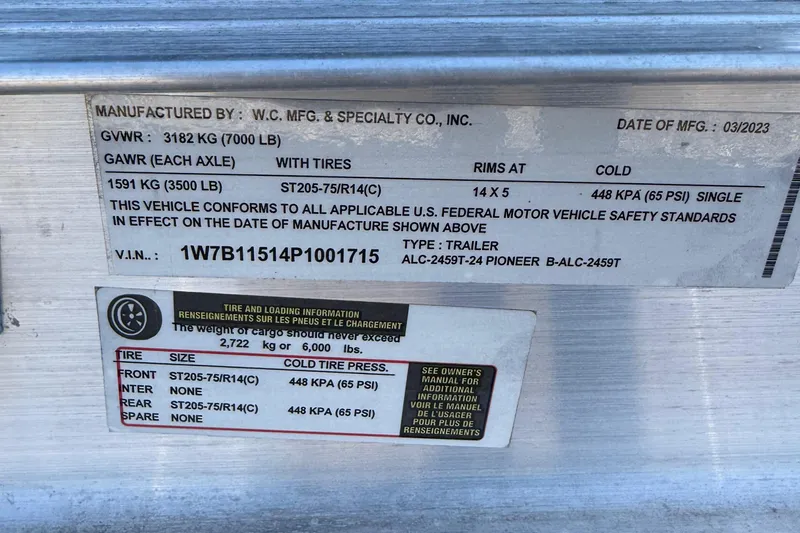 Slide: The Image of Trailer specification label showing weight, tire, and pressure details for Avenger AV24, 2017 model. - 22