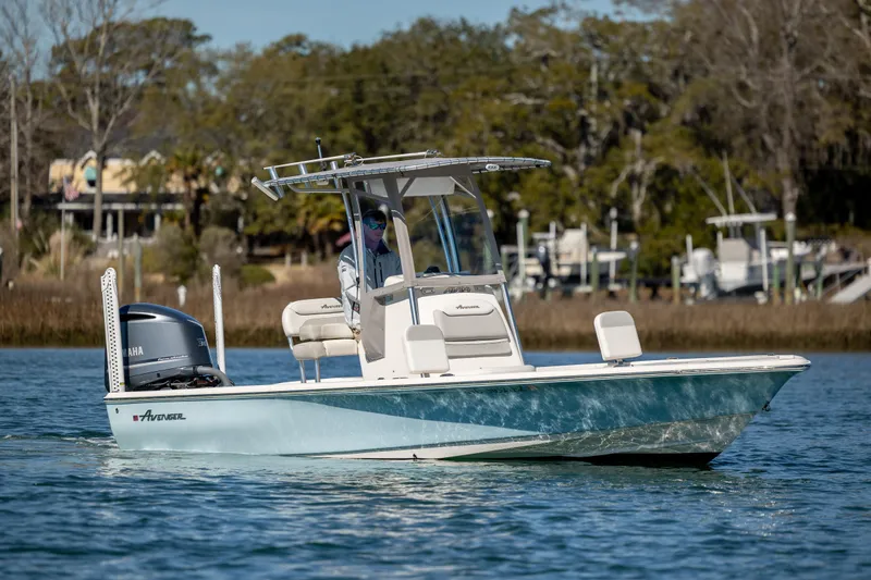 Slide: The Image of 2017 Avenger AV24 boat on water, featuring sleek design and powerful engine. - 3