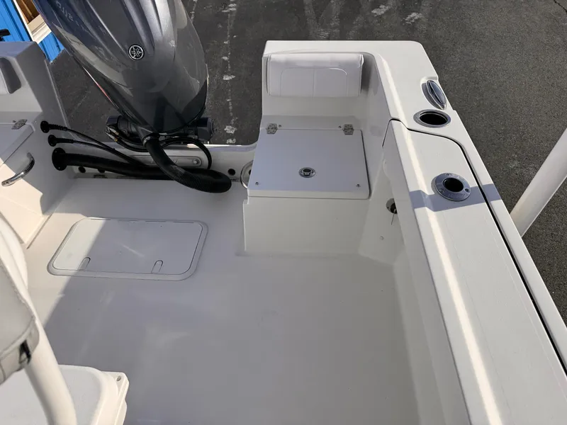 Slide: The Image of 2025 Parker 21 Special Edition boat interior with motor and seating area. - 11