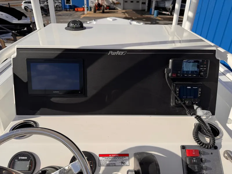 Slide: The Image of Control panel of Parker 21 Special Edition boat, 2025 model, featuring navigation screens and controls. - 13
