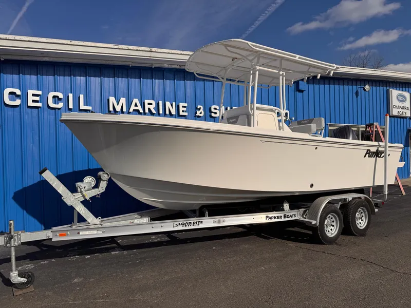 Slide: The Image of 2025 Parker 21 Special Edition boat on trailer at Cecil Marine dealership. - 2