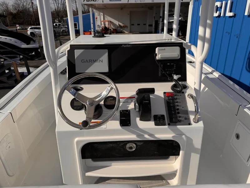 Slide: The Image of Control console of 2025 Parker 21 Special Edition boat with Garmin navigation system. - 22