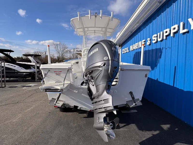 Slide: The Image of 2025 Parker 21 Special Edition boat with Yamaha outboard at marine supply store. - 4