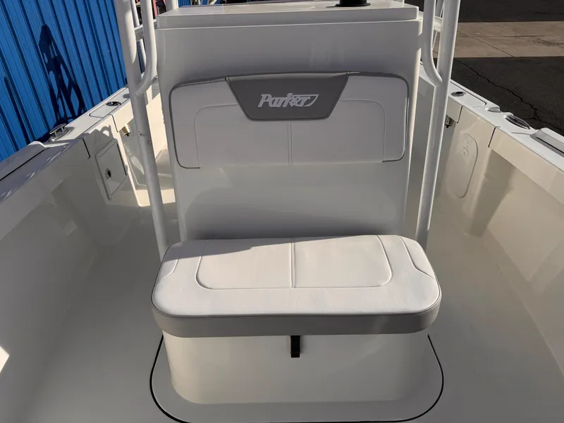 Slide: The Image of Parker 21 Special Edition 2025 boat seat, white upholstery, outdoor setting. - 6