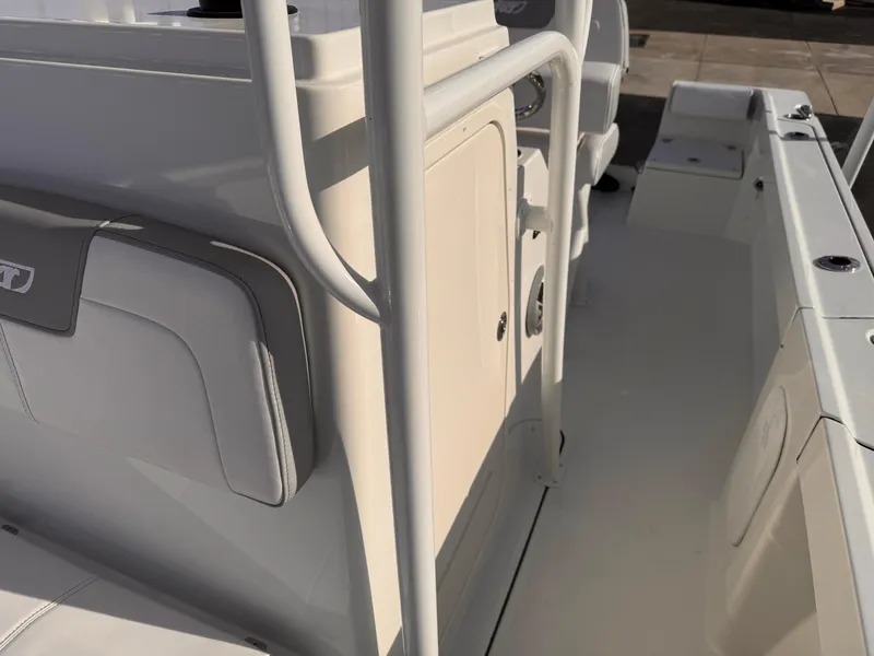 Slide: The Image of 2025 Parker 21 Special Edition boat interior with white seating and storage compartments. - 9
