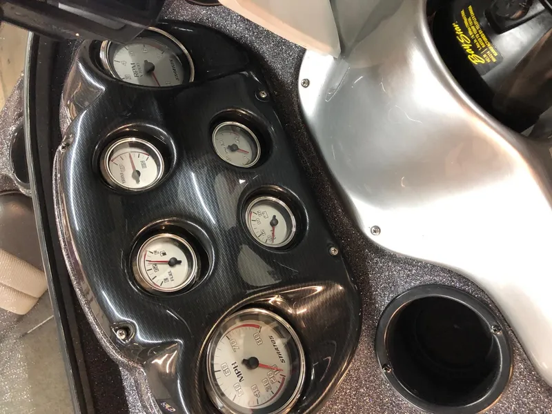 Slide: The Image of Dashboard of a 2015 Stratos 486 SF boat with multiple gauges and controls. - 3