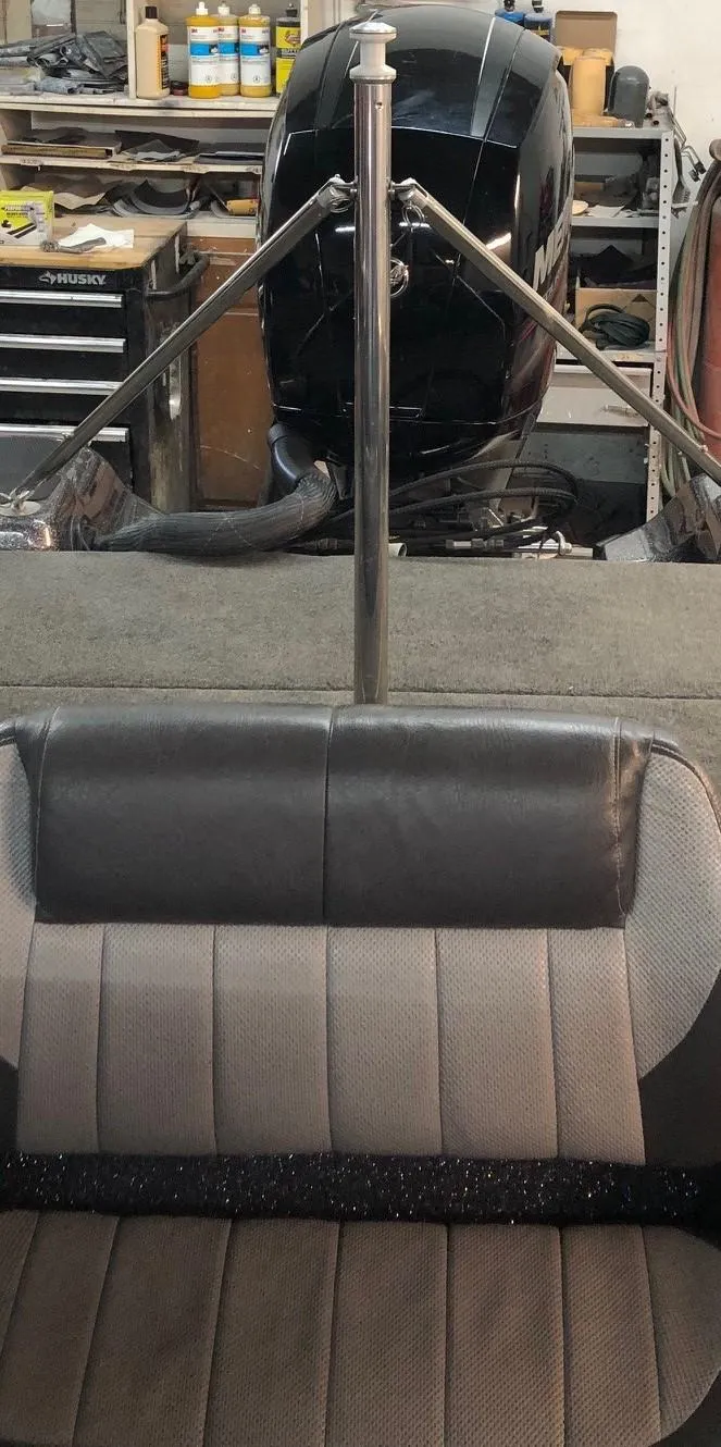 Slide: The Image of 2015 Stratos 486 SF boat interior with motor and seating. - 6