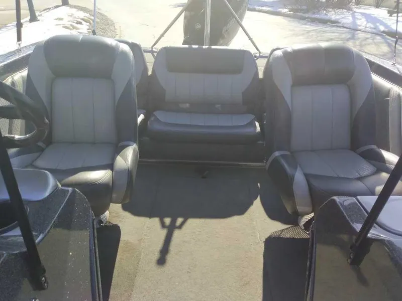 Slide: The Image of 2015 Stratos 486 SF boat interior with gray seating and steering wheel. - 7