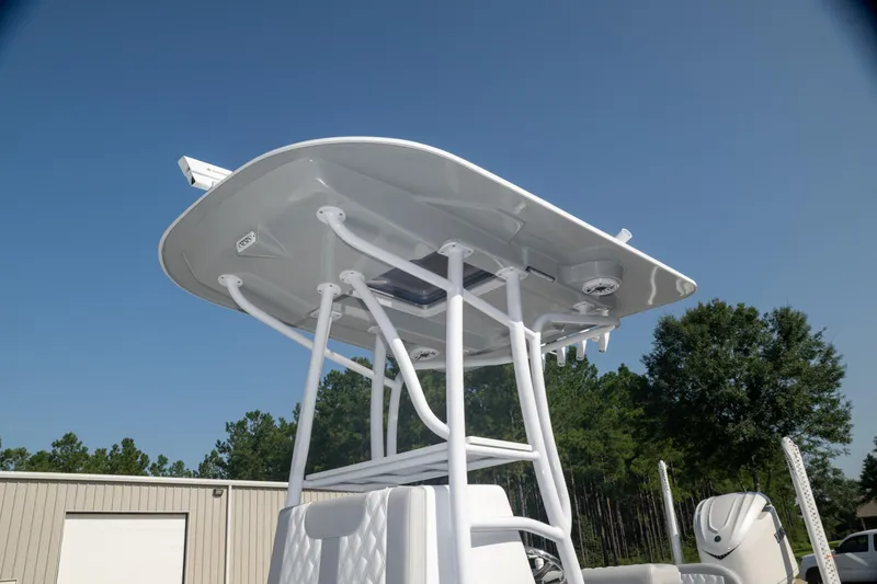 Slide: The Image of 2025 Contender 26 Bay boat with T-top against clear sky. - 10