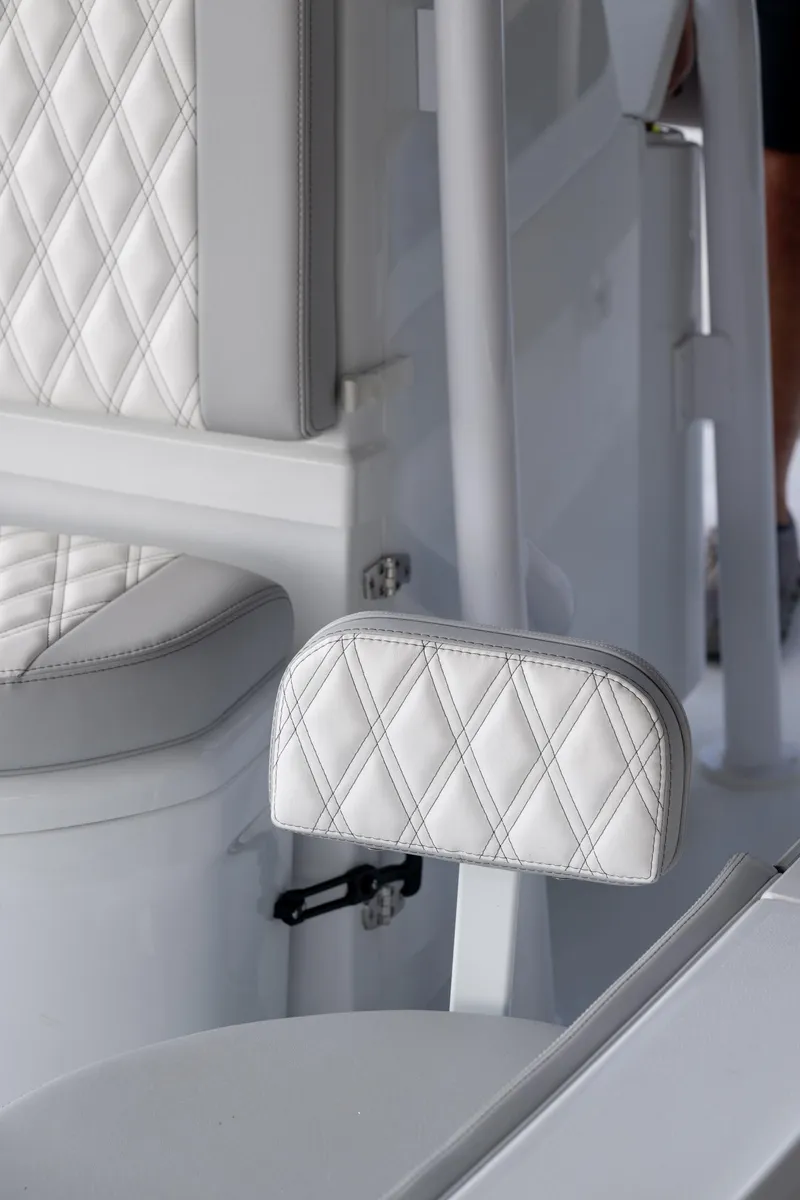 Slide: The Image of 2025 Contender 26 Bay boat interior with white quilted seating. - 18