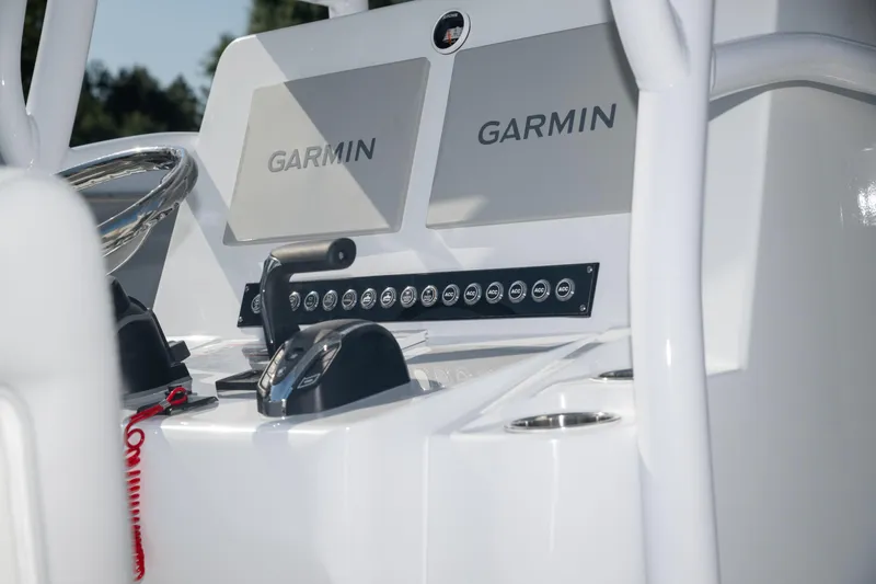 Slide: The Image of Control panel of 2025 Contender 26 Bay boat with Garmin displays. - 5