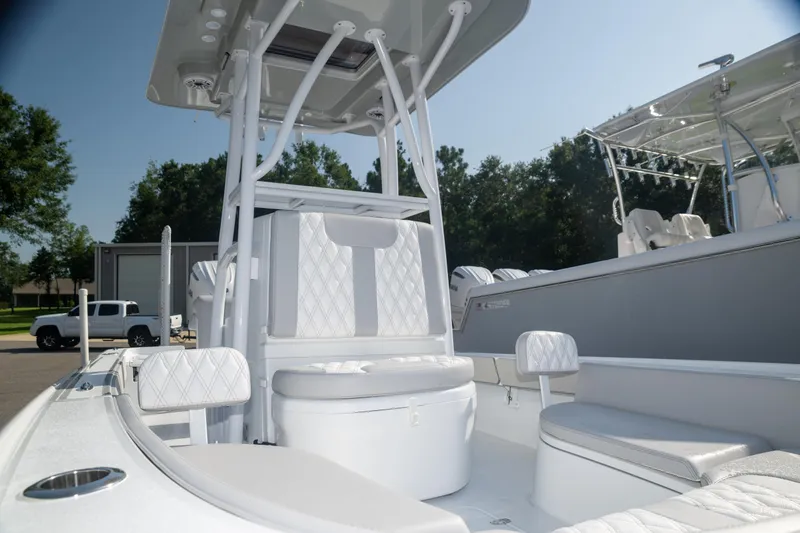 Slide: The Image of 2025 Contender 26 Bay boat interior with seating and console, showcasing modern design. - 6