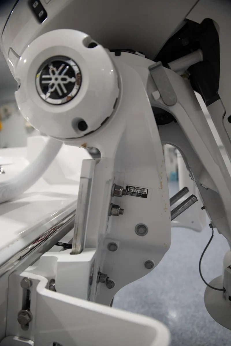 Slide: The Image of Close-up of 2024 Contender 23 Bay boat's engine mount with Yamaha branding. - 7