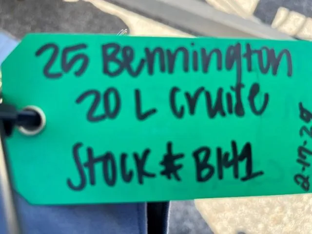 Slide: The Image of Green tag with handwritten details for 2025 Bennington 20L Cruise, stock number BH1. - 3