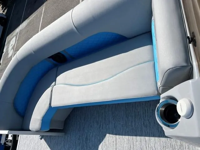 Slide: The Image of 2025 Bennington 20L Cruise boat interior with gray and blue seating. - 8