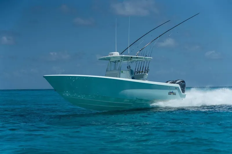 The Image of 2024 Contender 35 ST boat cruising on clear blue ocean waters. - 0