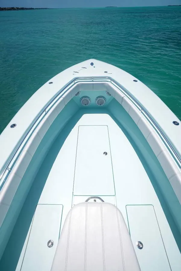 Slide: The Image of 2024 Contender 35 ST boat on clear turquoise water. - 9