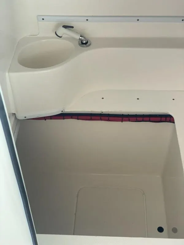 Slide: The Image of 2023 Contender 35 ST boat interior with sink and storage area. - 13