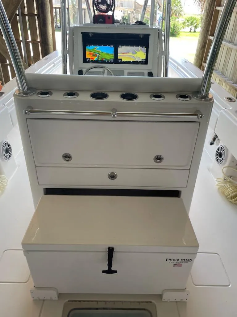 Slide: The Image of 2023 Contender 35 ST boat console with navigation display and storage compartments. - 14