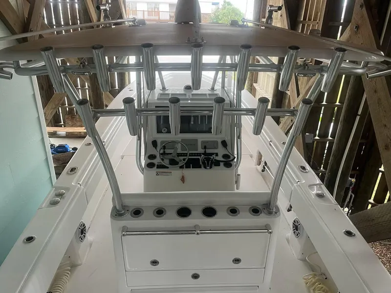 Slide: The Image of 2023 Contender 35 ST boat cockpit with rod holders and control panel. - 18