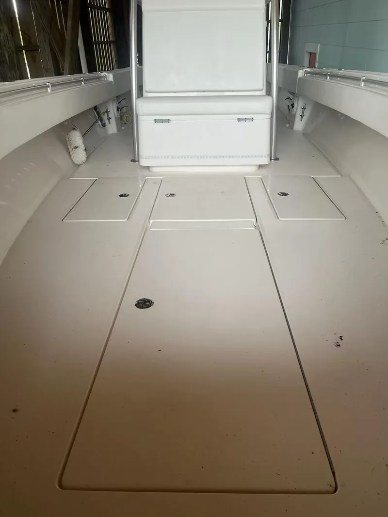 Slide: The Image of 2023 Contender 35 ST boat interior, spacious deck with storage compartments. - 19