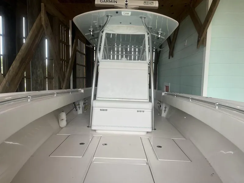 Slide: The Image of 2023 Contender 35 ST boat interior with center console and Garmin equipment. - 20