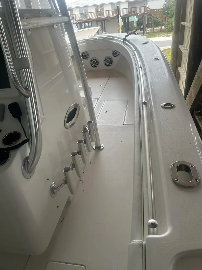 Slide: The Image of 2023 Contender 35 ST boat interior with rod holders and sleek design. - 21