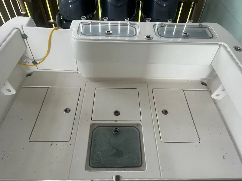 Slide: The Image of 2023 Contender 35 ST boat deck with storage compartments and live wells. - 25