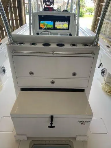 Slide: The Image of 2023 Contender 35 ST boat console with storage and navigation display. - 32