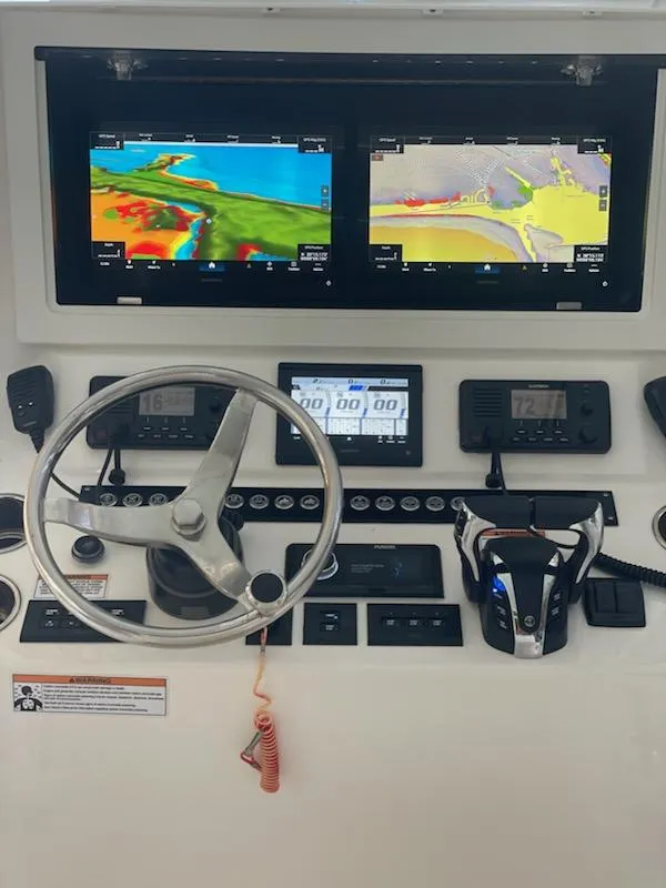 Slide: The Image of 2023 Contender 35 ST dashboard with navigation screens and controls. - 9