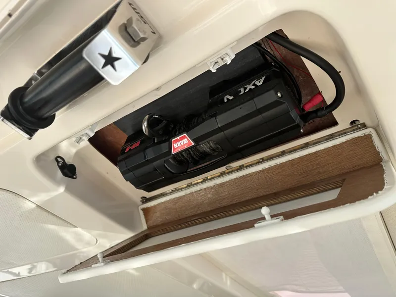 Slide: The Image of 2013 Tiara Yachts 3900 Open electrical compartment with wiring and components. - 17
