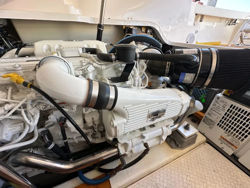 Slide: The Image of Engine compartment of a 2013 Tiara Yachts 3900 Open, showcasing detailed mechanical components. - 20
