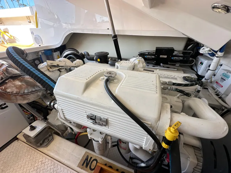 Slide: The Image of Engine compartment of a 2013 Tiara Yachts 3900 Open, showcasing mechanical components. - 21