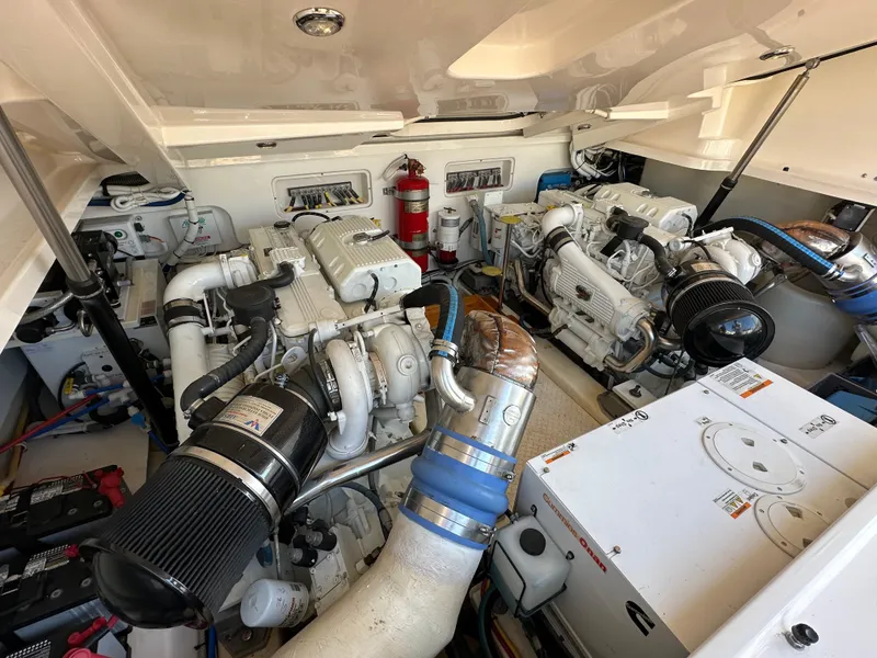 Slide: The Image of Engine room of 2013 Tiara Yachts 3900 Open, showcasing dual engines and equipment. - 27