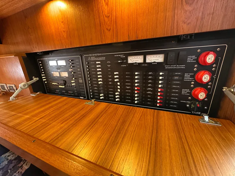Slide: The Image of Electrical control panel on 2013 Tiara Yachts 3900 Open, featuring switches and gauges. - 28