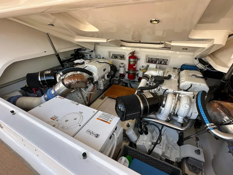 Slide: The Image of Engine room of 2013 Tiara Yachts 3900 Open, featuring dual engines and equipment. - 30