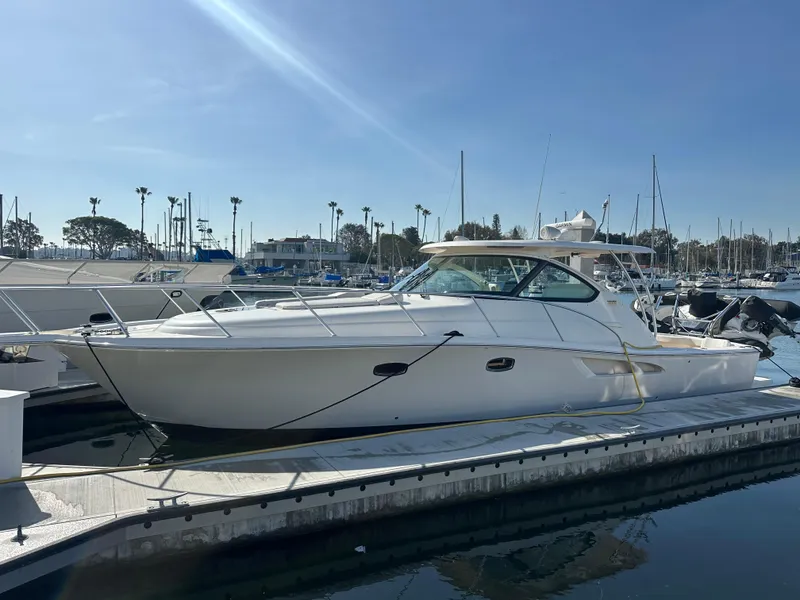 Slide: The Image of 2013 Tiara Yachts 3900 Open docked in a sunny marina. - 31