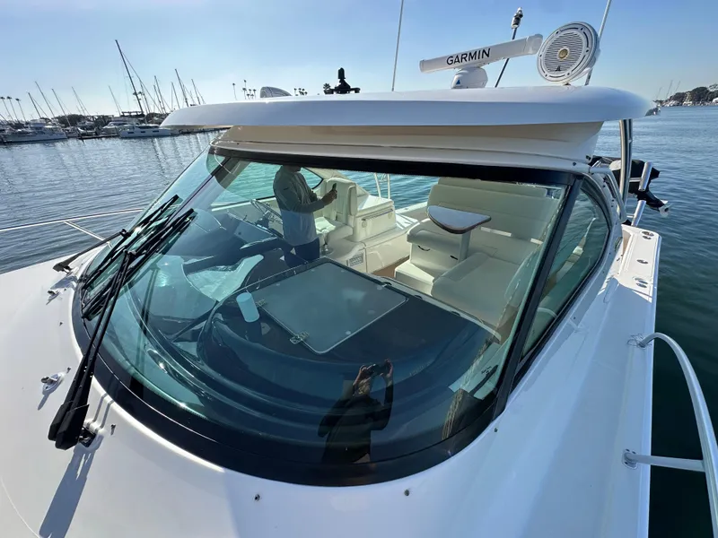 Slide: The Image of 2013 Tiara Yachts 3900 Open with Garmin equipment, docked in a marina. - 34