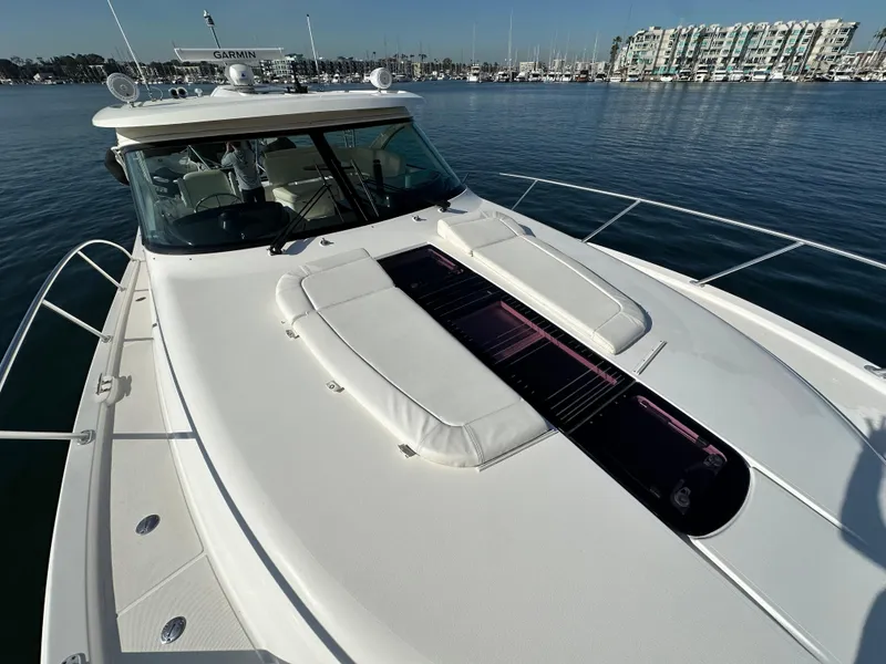 Slide: The Image of 2013 Tiara Yachts 3900 Open on calm water, showcasing sleek deck design. - 40