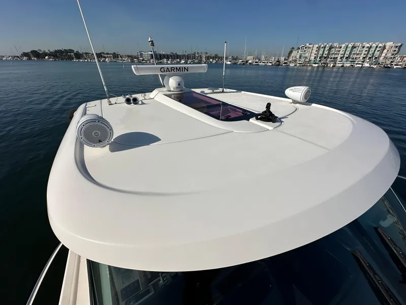 Slide: The Image of 2013 Tiara Yachts 3900 Open on calm water, featuring Garmin equipment. - 41