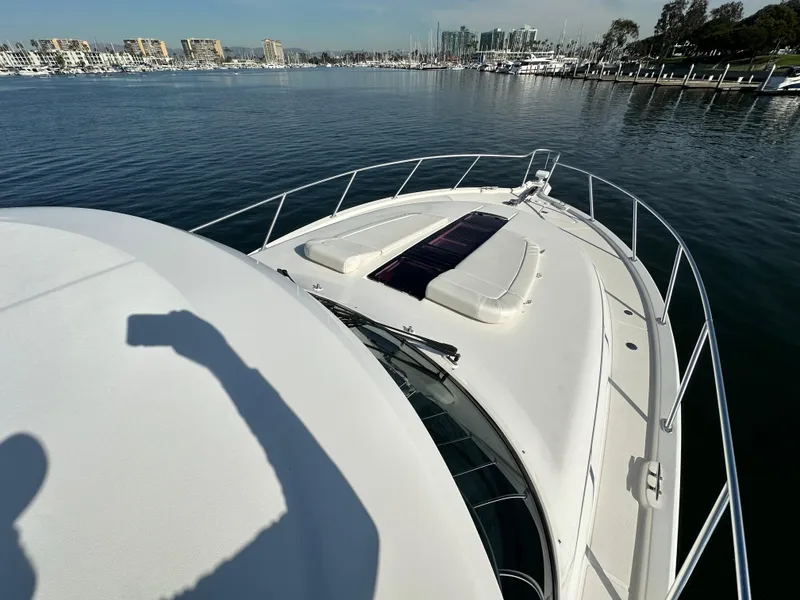 Slide: The Image of 2013 Tiara Yachts 3900 Open on calm water, marina in background. - 42